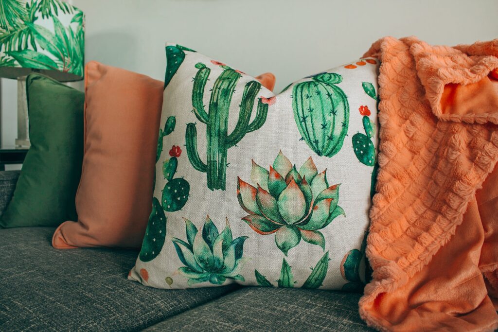 a sofa with floral cushions