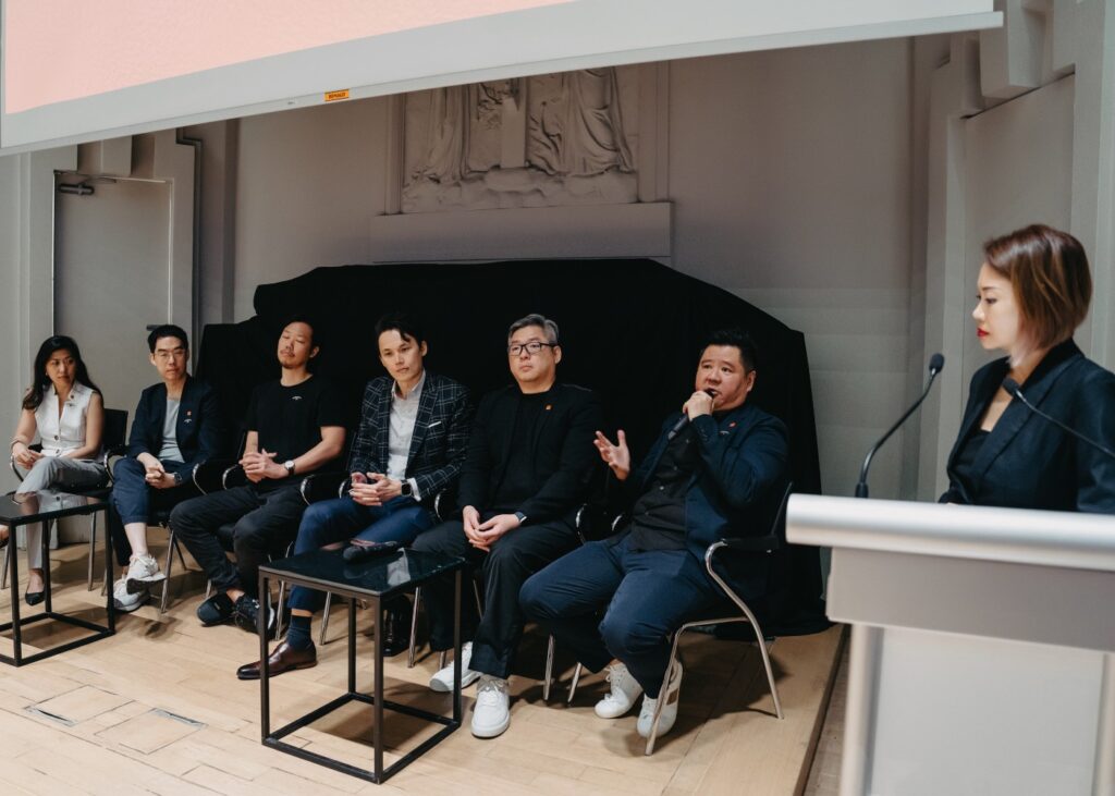 group of speakers in an auditorium