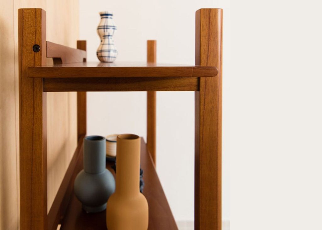 a wooden rack with vases and other objects