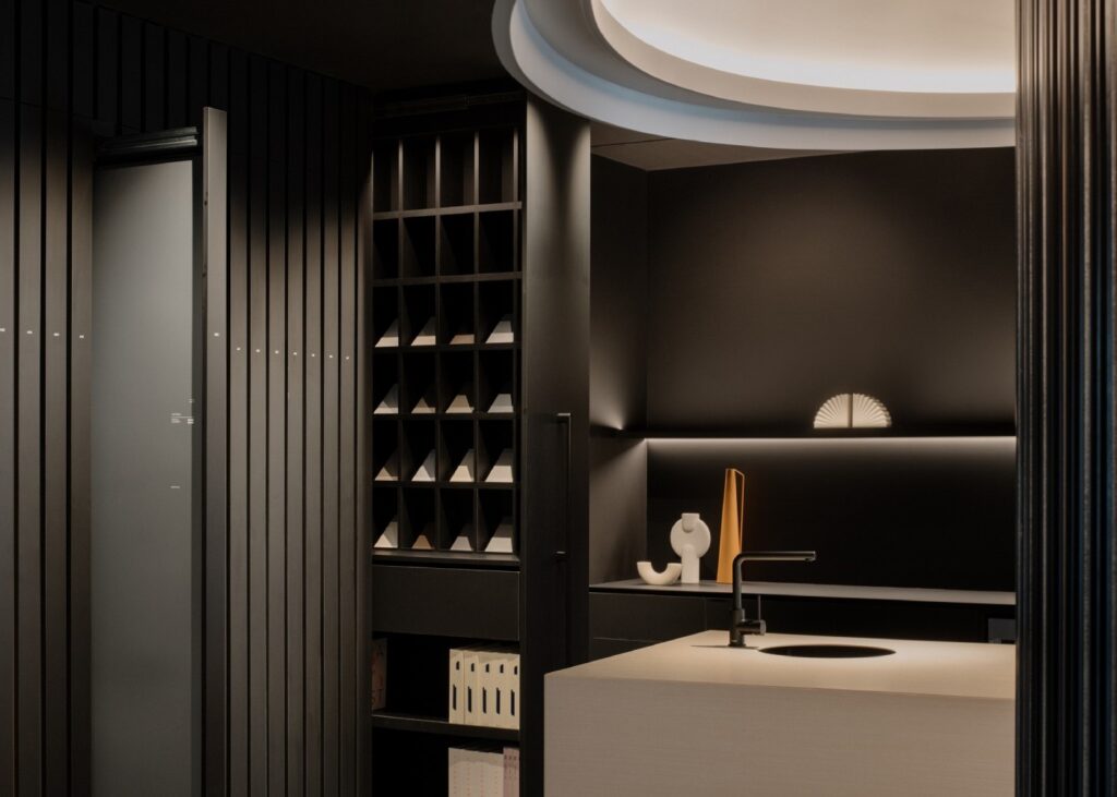 a space with sample display of laminate finished countertops and backsplashes all in black