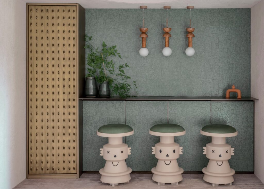 a front view of a bar in tones of green and brass in a luxury apartment