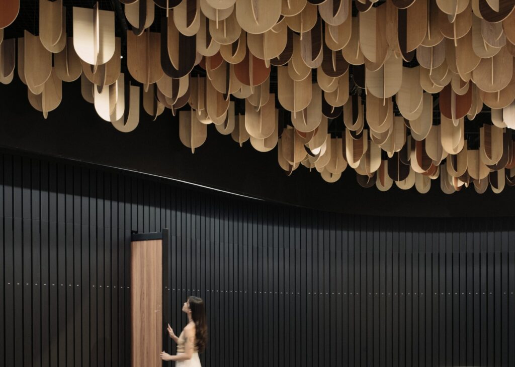 a lady exploring laminates at a finishes showroom