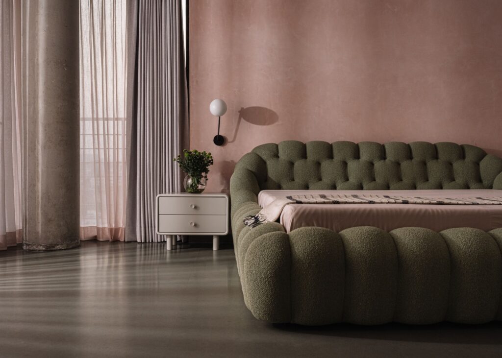 view of a modern bedroom in rose pink and contemporary furniture