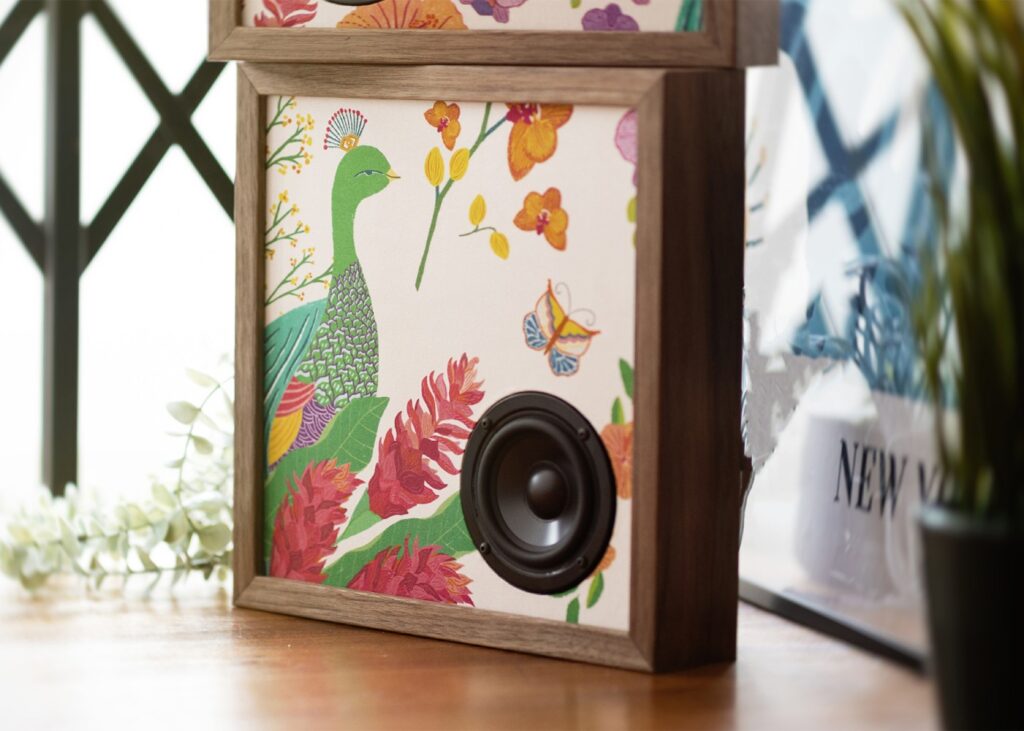 a unique music speaker with a peacock print on it