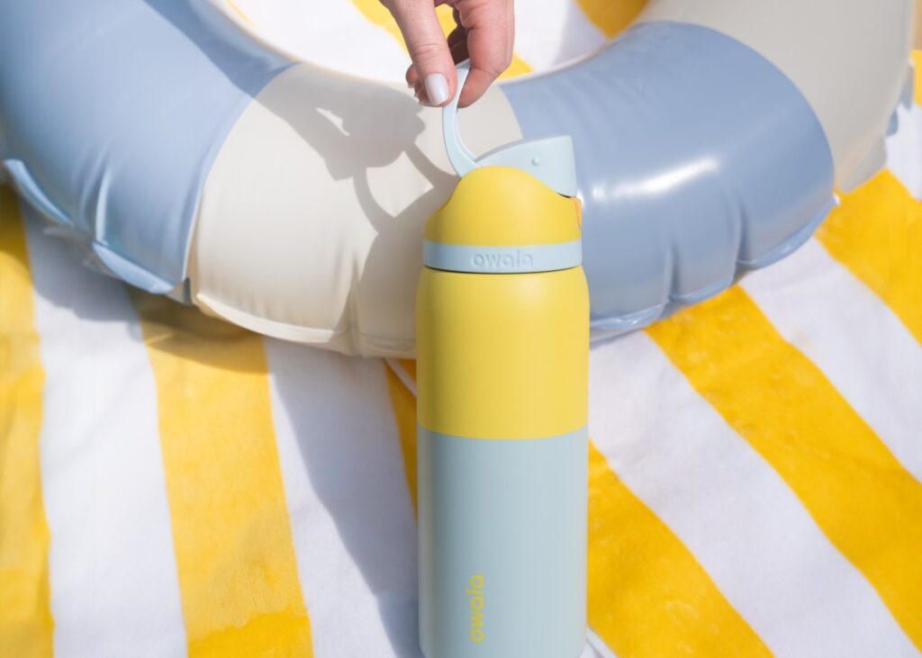 a yellow water bottle near a swimming tube