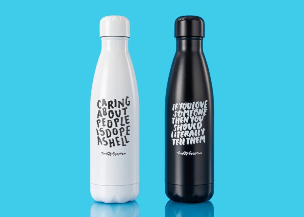 a black and white bottle with quotes on them