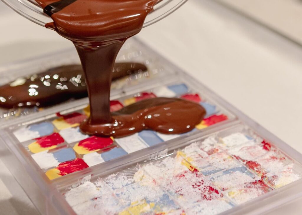 chocolate being poured into a mold