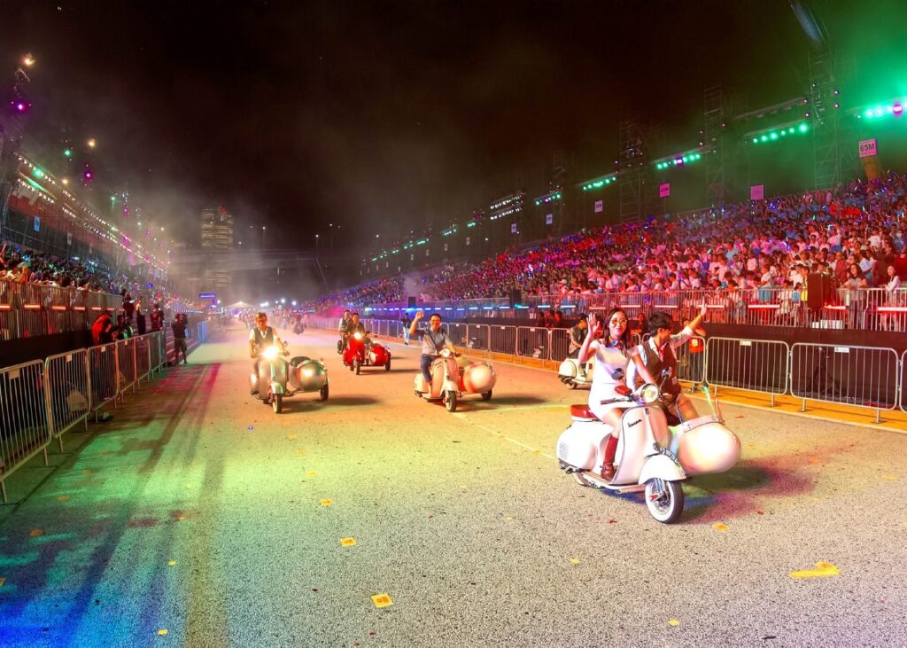 people riding in side cars in singapore