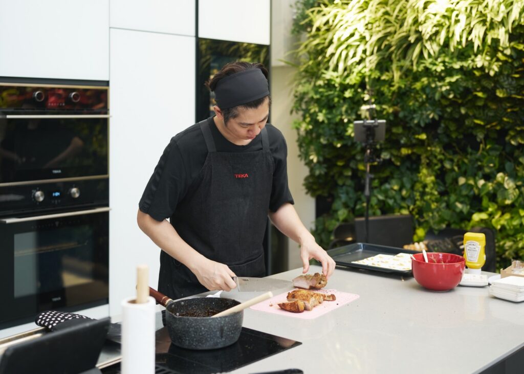 chef doing a cooking demo in a modern kitchen