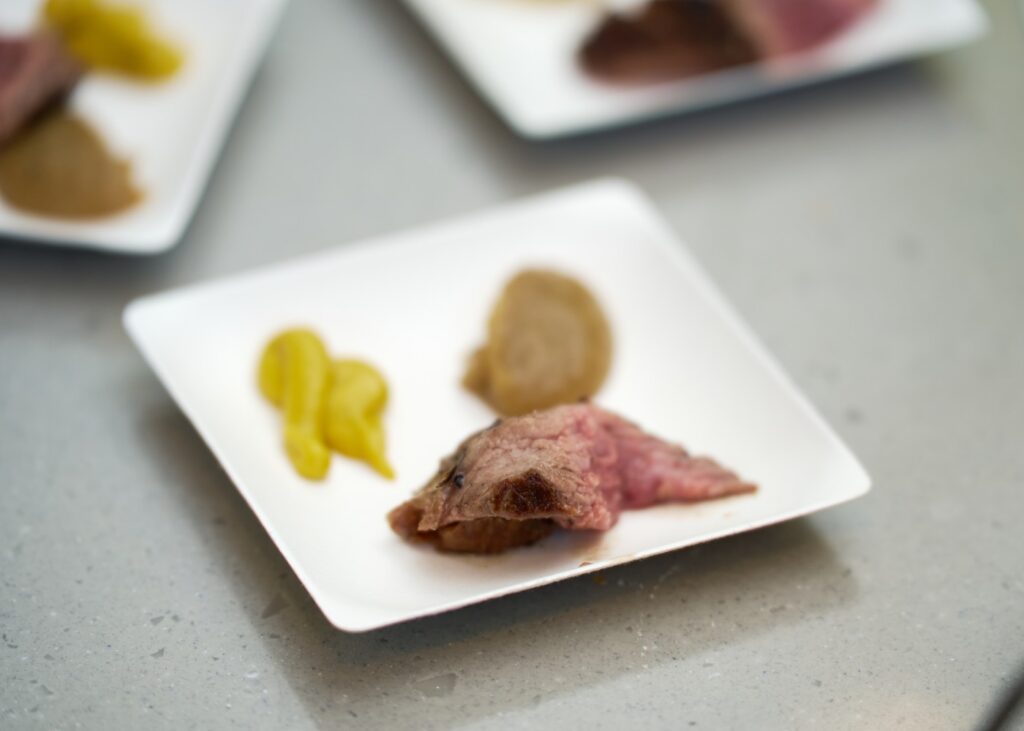 dishes plated with roast meat and sides