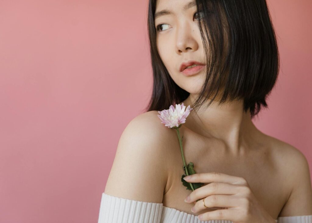 asian woman model holding a flower