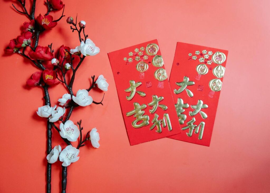 chinese new year flowers and red packets