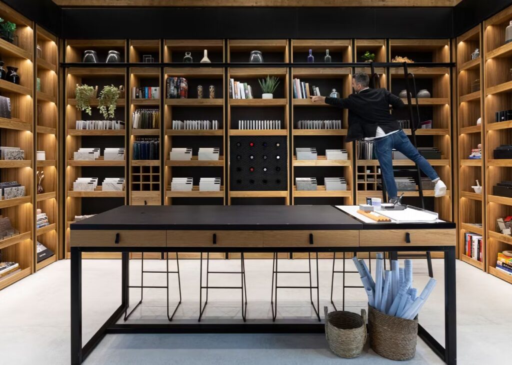 a man exploring materials at a quartz surfaces show room