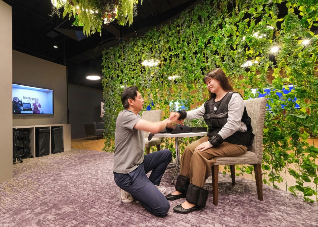 man introducing a visitor to eldercare facilities